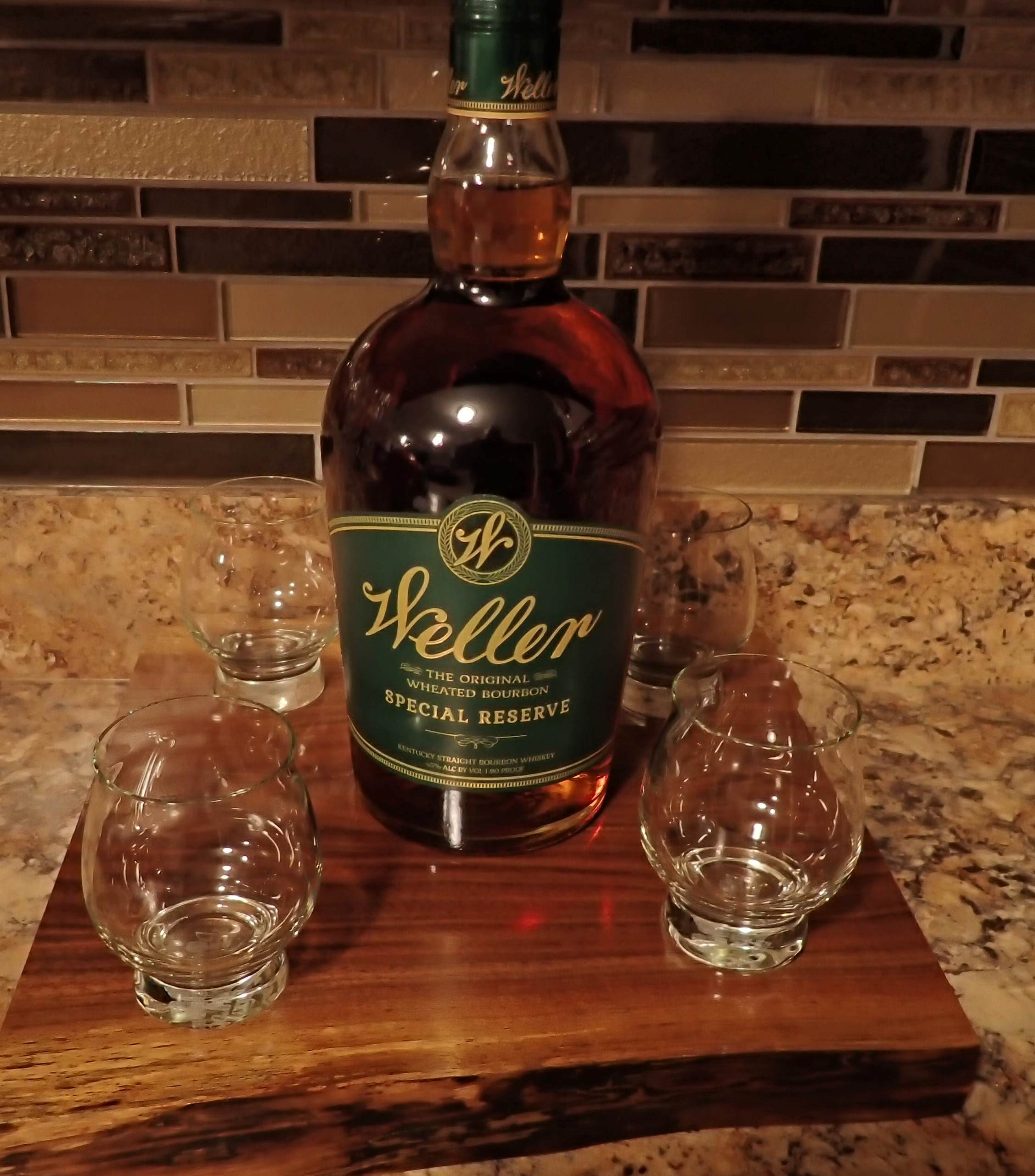 board with bottle and 4 glasses